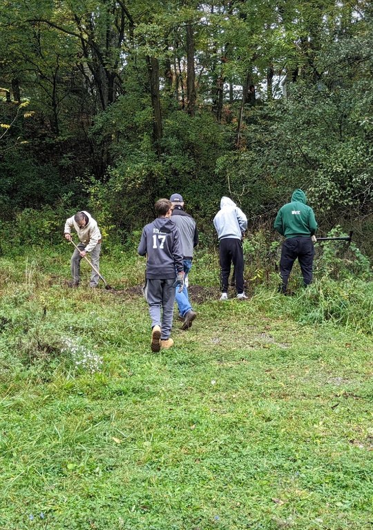 Pine Lacrosse members work on the trail